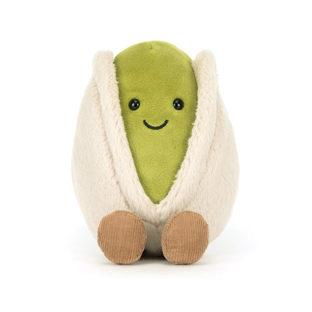 Stuffed plush pistachio toy with a smiling face.
