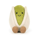 Stuffed plush pistachio toy with a smiling face.
