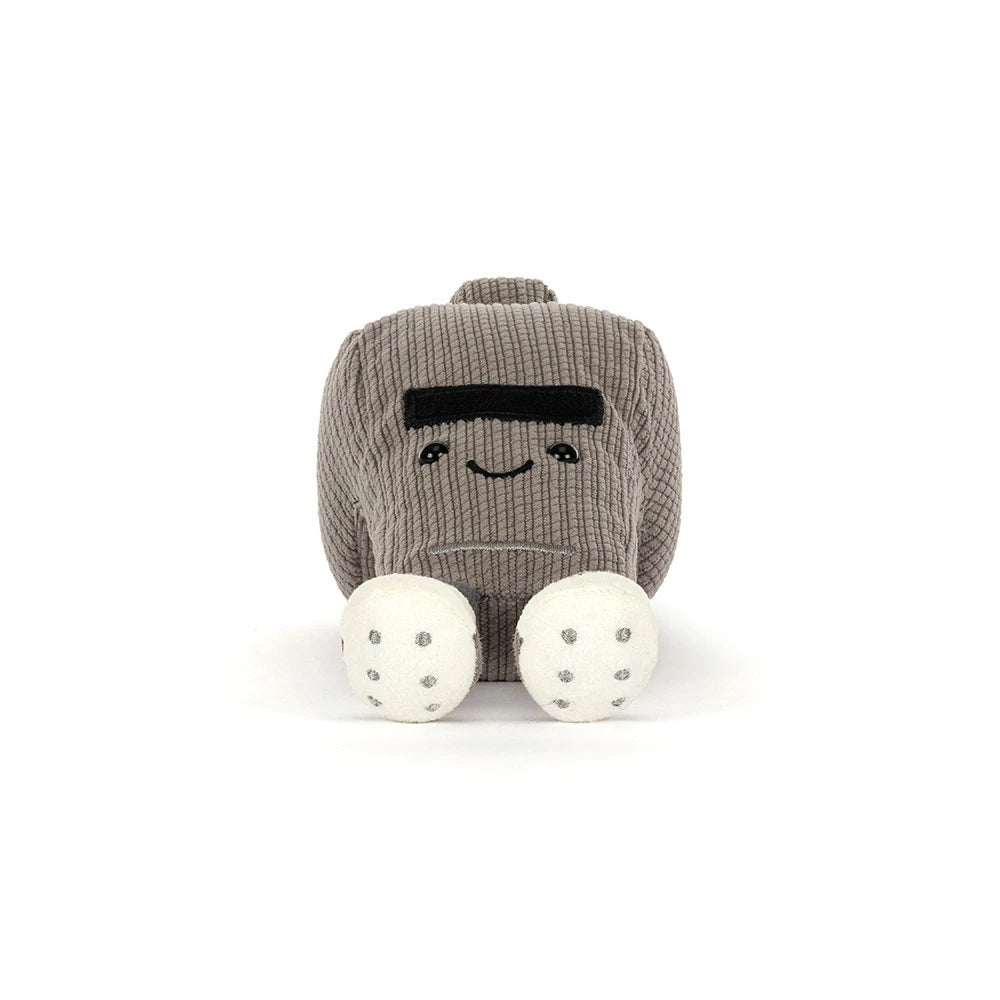 Plush toy resembling a robot with a smiling face on a white background