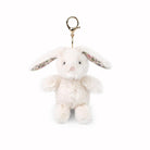 White fluffy bunny keychain with floral band on a white background