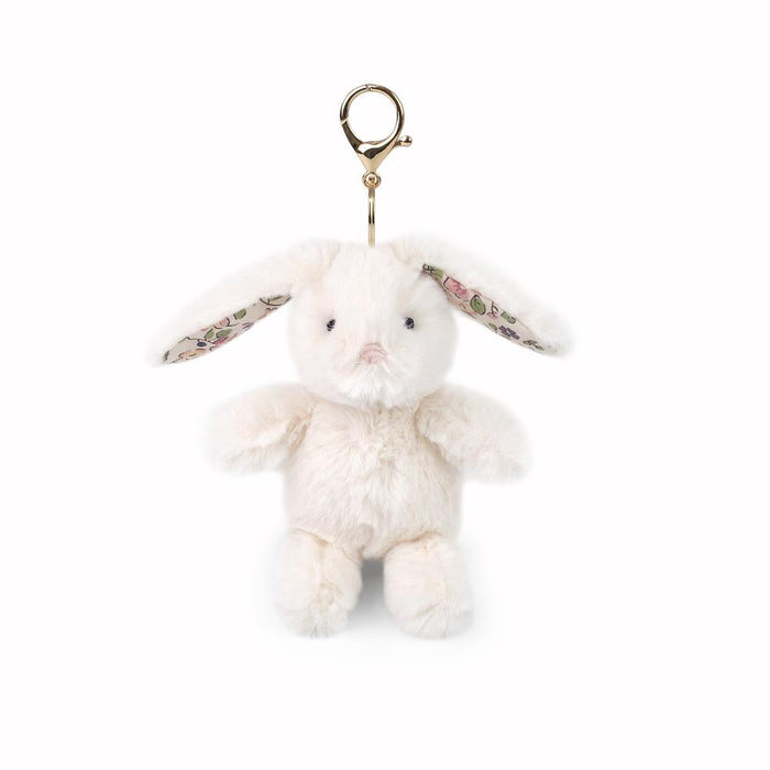 White fluffy bunny keychain with floral band on a white background