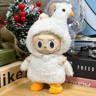 Toy figurine with a white hooded fluffy costume, orange duck feet, and a smirk.