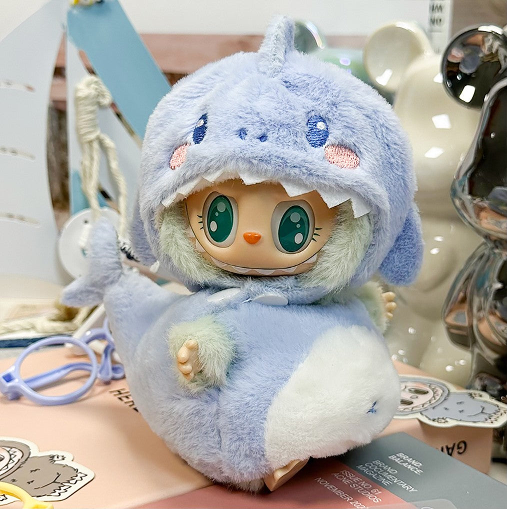 Cute, plush, light-blue shark doll.