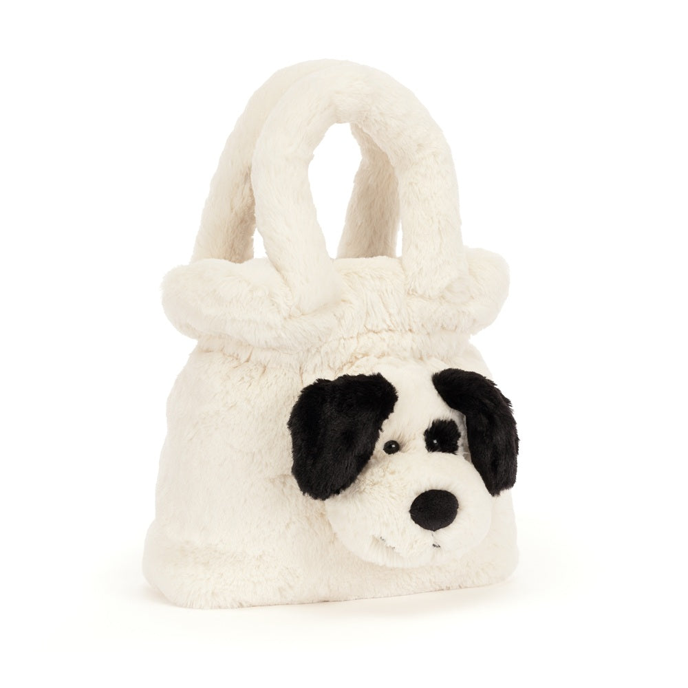 A plush white dog-shaped handbag with black ears, black eyes, and a black nose, photographed on a clean white background.