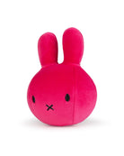 Pink plush toy with a simple face on a white background