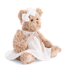 Teddy bear in a white dress with a bow on a white background
