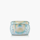 Decorative jar with a patterned lid on a white background