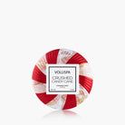 Voluspa crushed candy cane candle on a white background