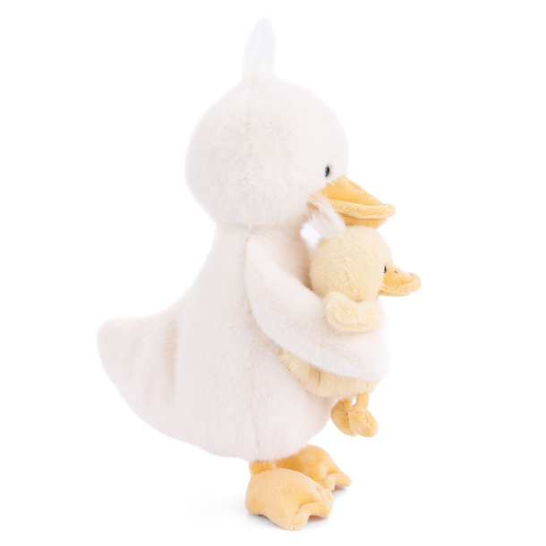 Plush toy of a goose holding a duckling on a white background