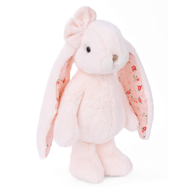 Pink plush bunny with floral patterns on a white background