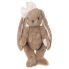 Plush toy rabbit with a bow on a white background