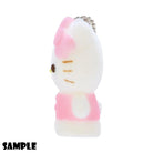 Side view of a white plush Hello Kitty keychain with a pink bow and dress.
