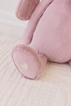 Close-up of a pink plush toy on a light surface