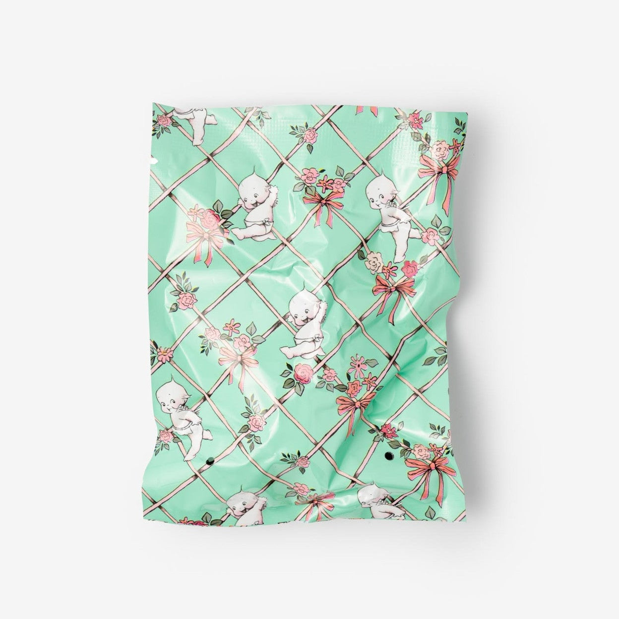 Green patterned fabric with cherub designs on a white background