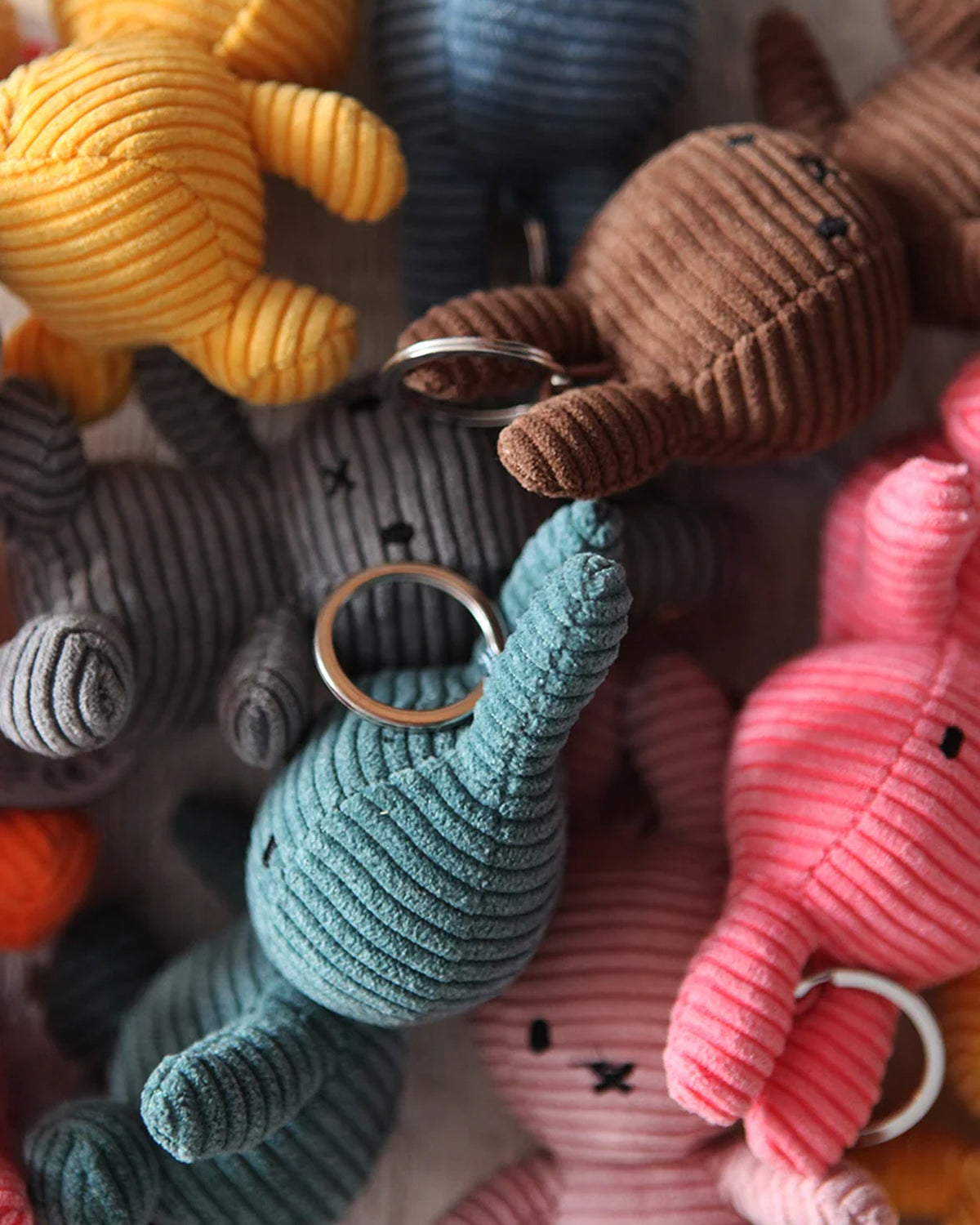 Collection of colorful plush keychains shaped like animals.