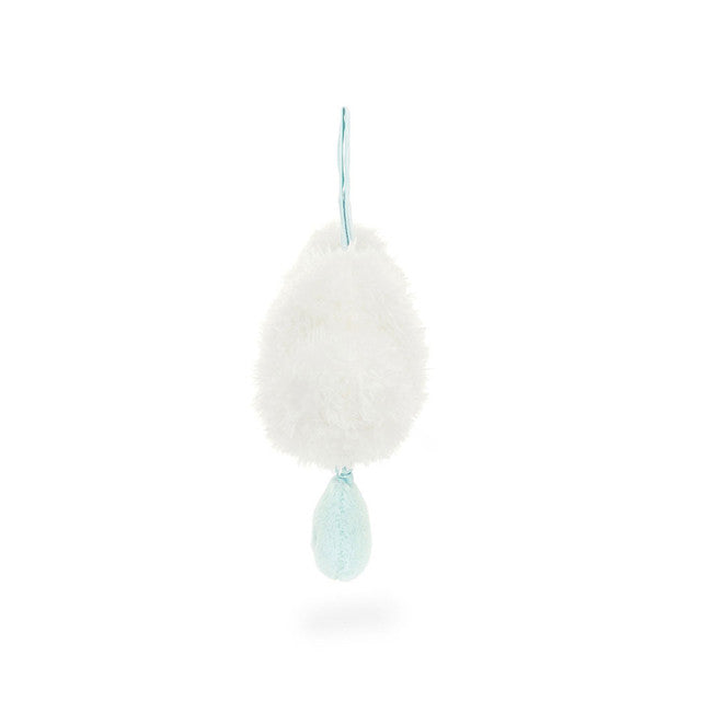 White, fuzzy shower pouf with a blue loop for hanging and a blue pom-pom at the bottom.
