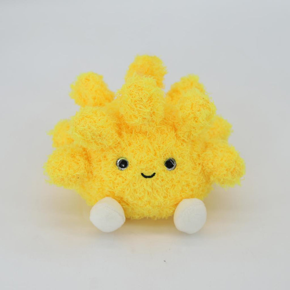Yellow plush toy with a happy face on a white background