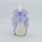 Plush toy dragon with purple fur and white accents on a light gray background