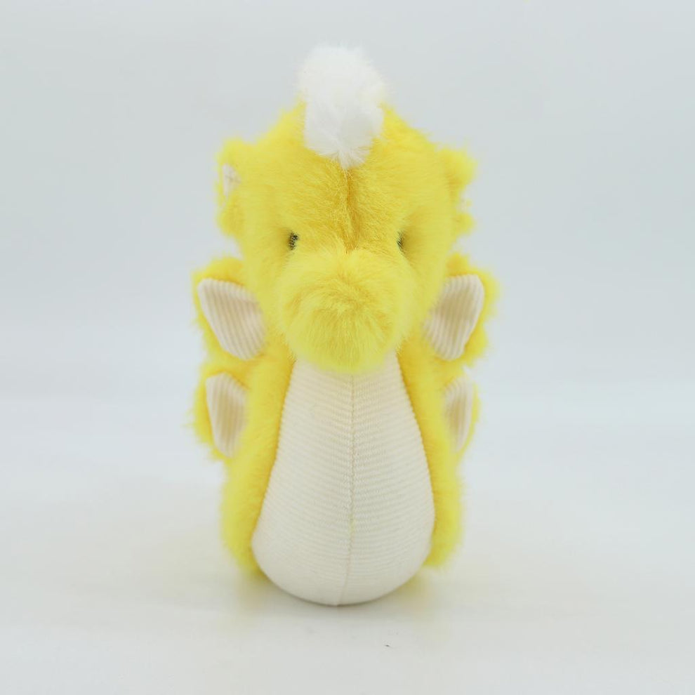 Yellow plush toy with white accents on a light gray background