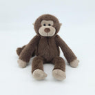 Brown monkey plush toy on a white background