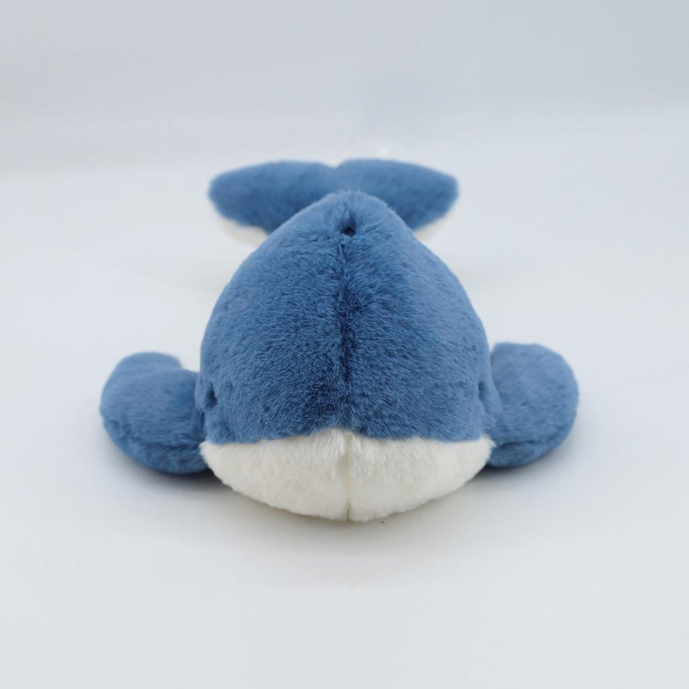 Blue plush shark toy on a white background