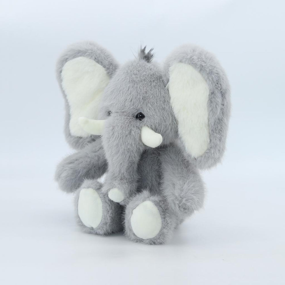 Gray plush elephant toy on a white background