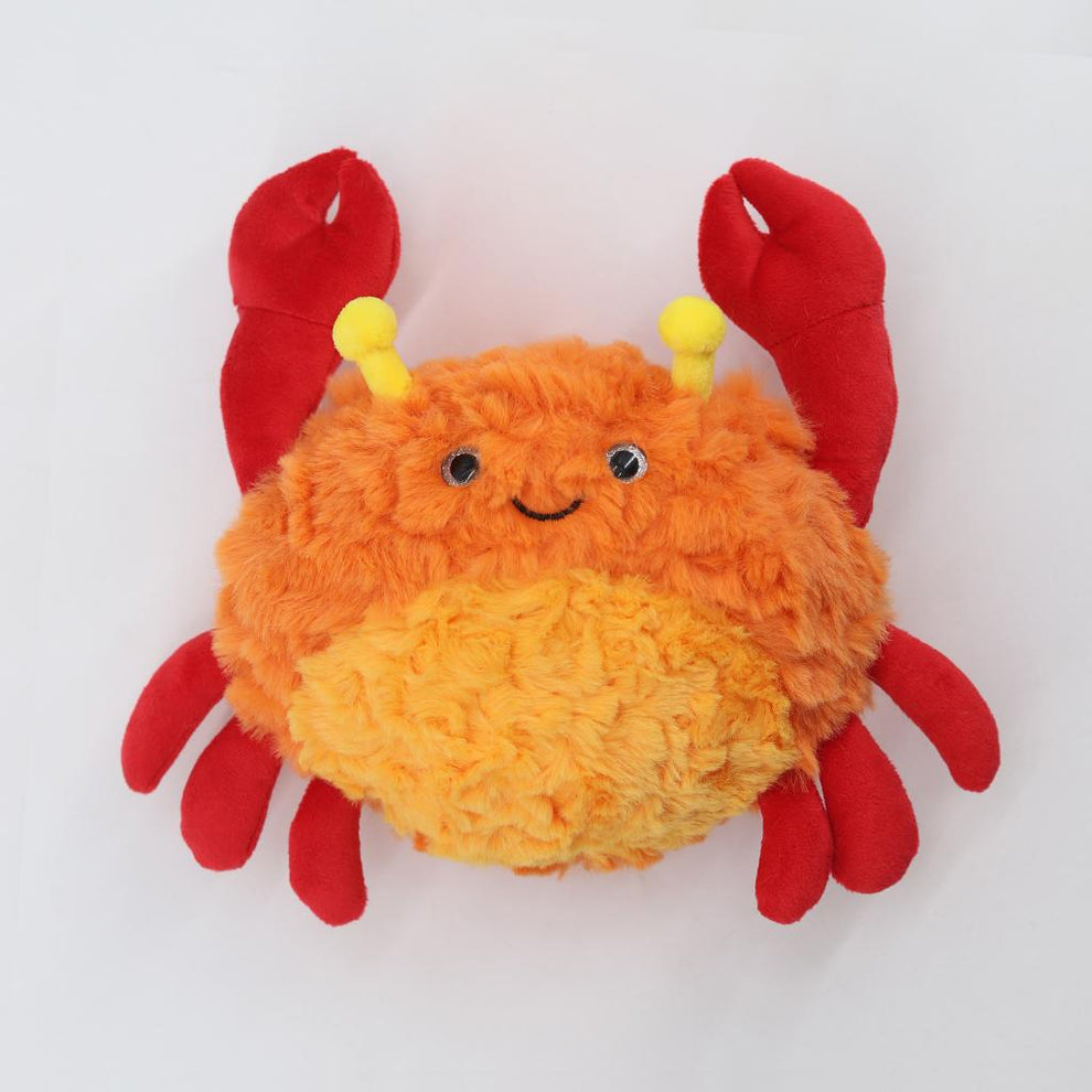 Plush crab toy with orange body and red legs on a white background
