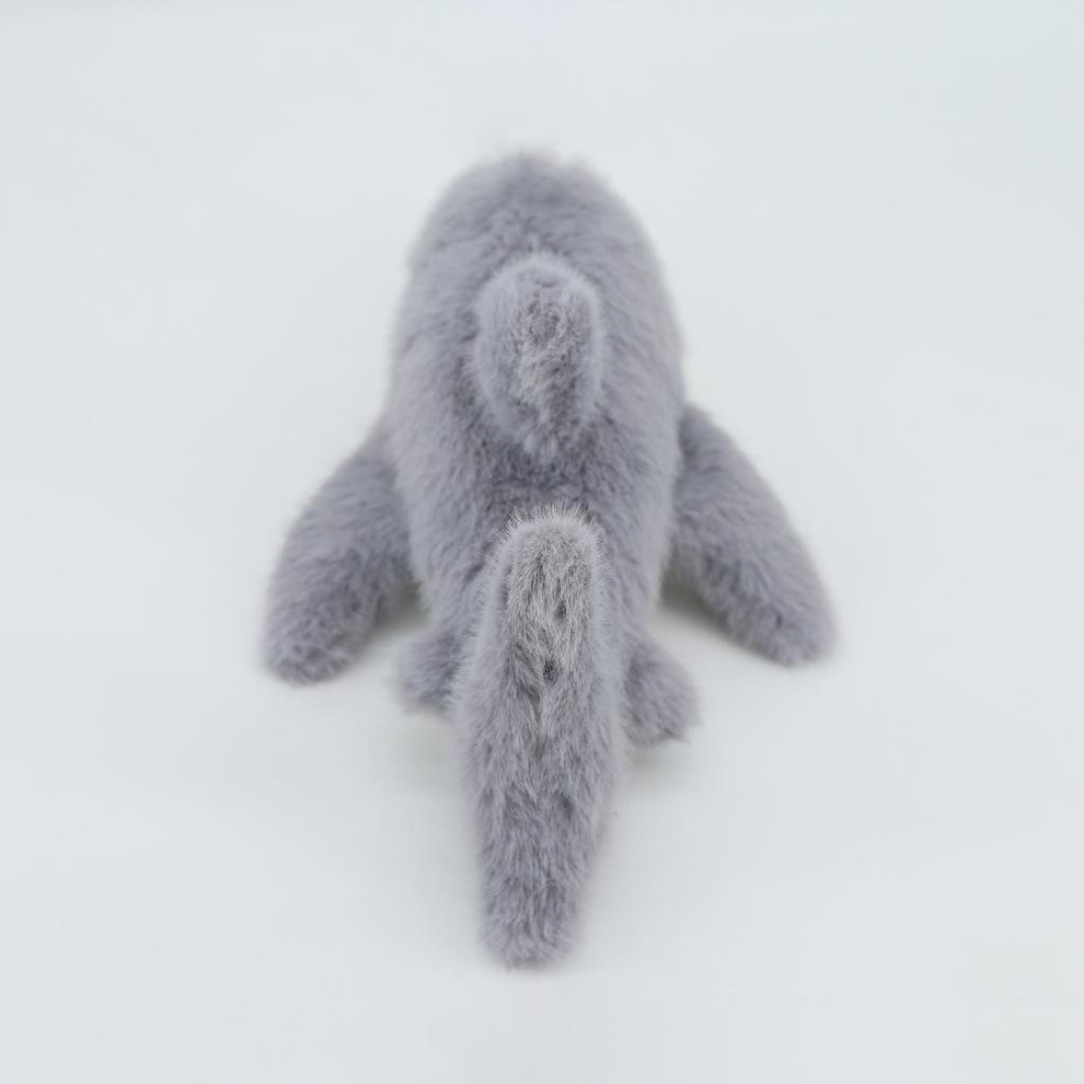 Gray plush toy on a white background