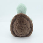 Plush toy resembling a mochi character with brown body and green top on a white background