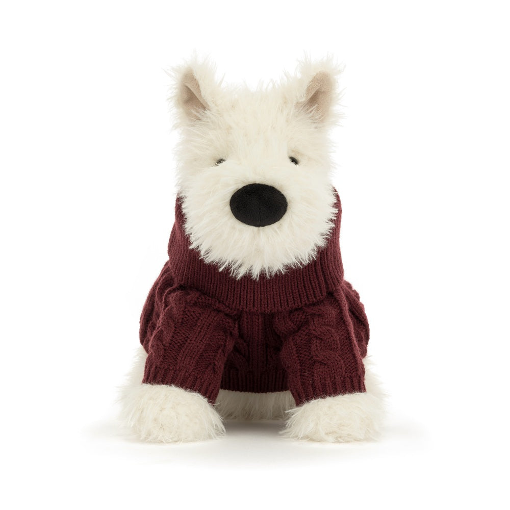 A plush dog toy wearing a burgundy cable-knit sweater, photographed against a seamless white background.