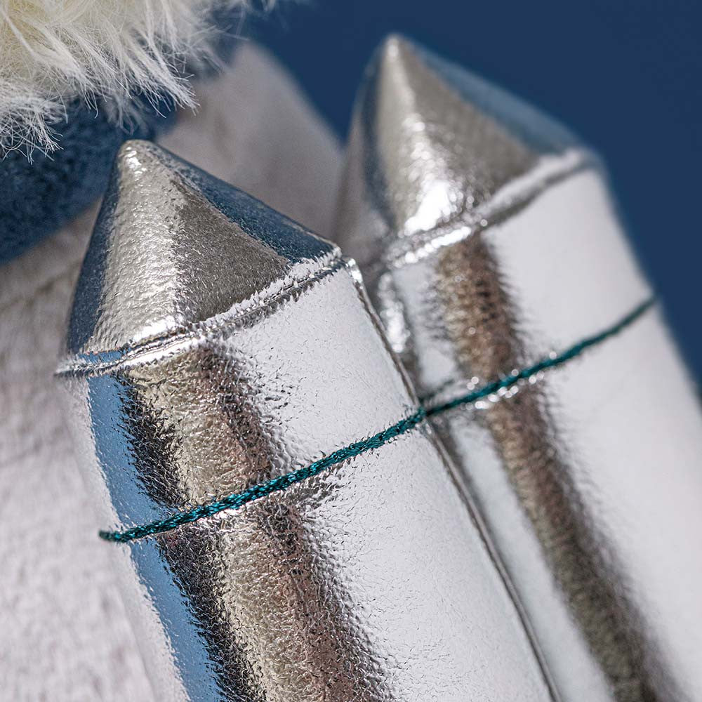 Shiny silver rocket boots with teal stitching on Jellycat Munro Scottie Dog, close-up side view