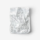 Pack of baby diapers with cartoon character print on a white background