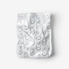 A crinkled silver metallic pouch featuring an all-over black line-art pattern of cartoon rabbits, shown against a plain light gray background.