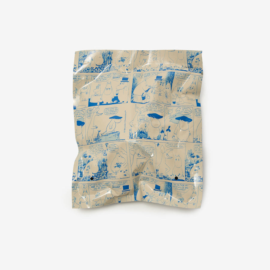 A crumpled plastic bag featuring a blue and beige comic-book style illustration pattern, photographed against a solid light gray background.