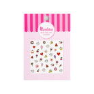 Package of nail art stickers with cute food designs.