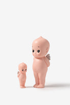 Two pink baby figurines on a white background