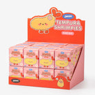 Display box of Tempura Shrimpies with a cartoon character on an orange background
