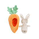 Carrot-shaped plush toy with green top and a white rabbit plush toy on a white background