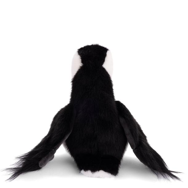 Black and white plush monkey toy on a white background