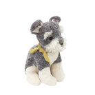 Plush toy dog with a yellow bow tie on a white background