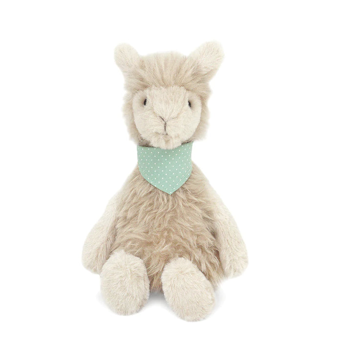 Tan, furry llama plush toy with a mint green polka-dot bandana, sitting.
