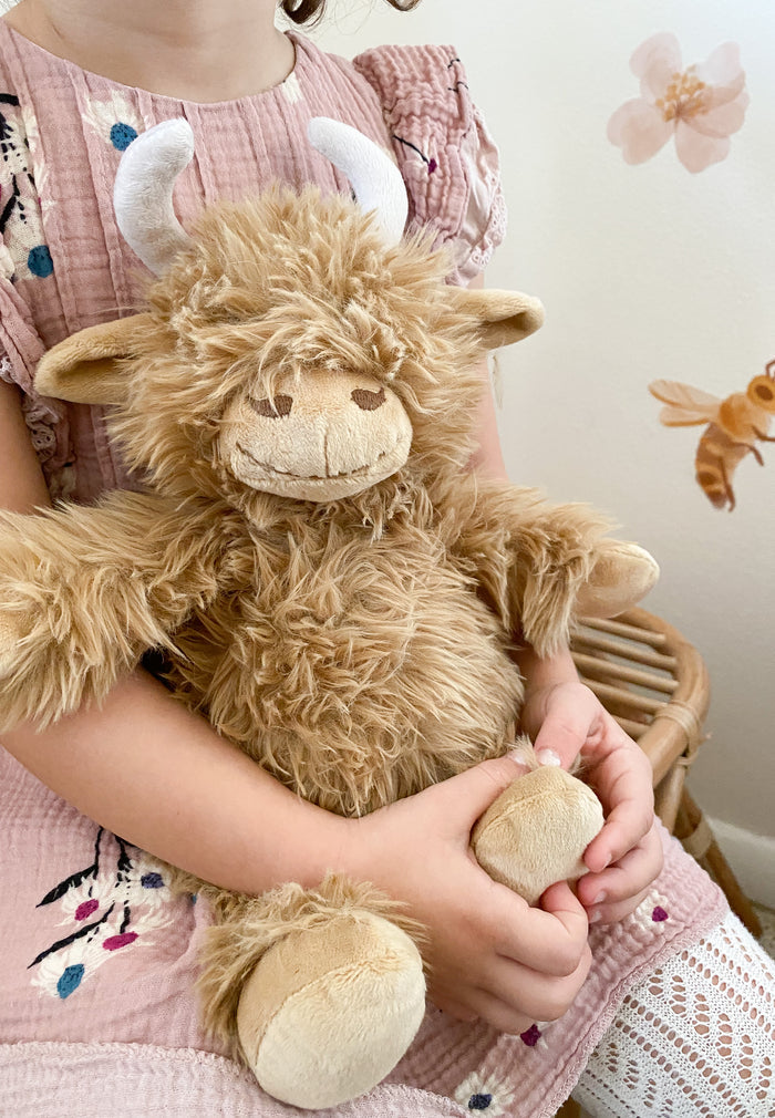 Plush toy cow with horns 