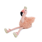 Stuffed flamingo toy wearing a gold crown and ballet slippers.
