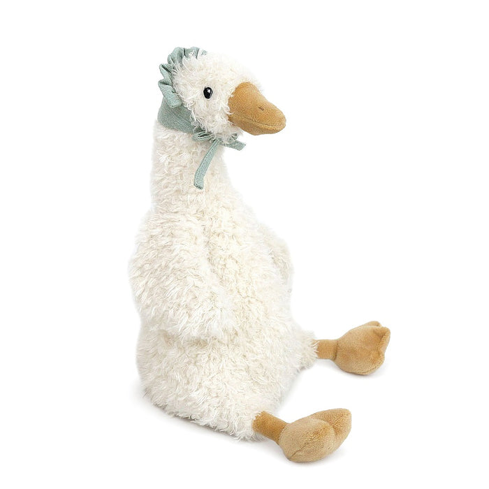 Stuffed goose toy with a sage green bonnet. 
