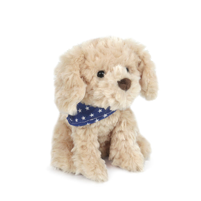 Tan plush dog wearing a blue bandana with white stars.
