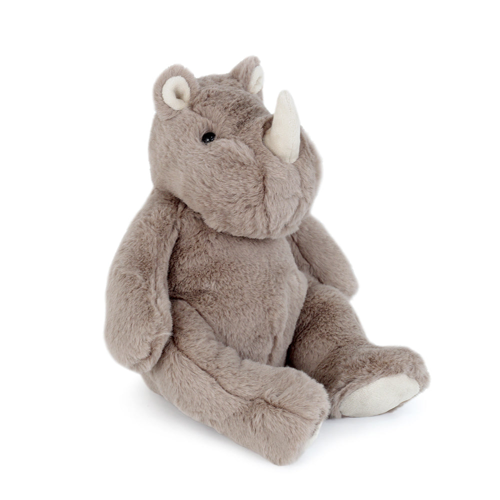 Grey plush rhinoceros toy sitting.