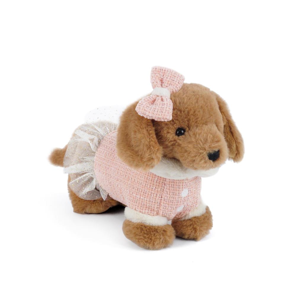 Plush dog toy with a pink outfit and bow on a white background