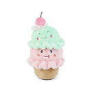 Plush toy resembling a ice cream cone with a smiling face on a white background