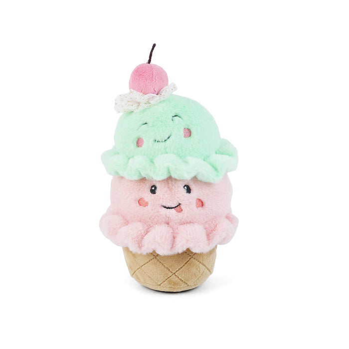 Plush toy resembling a ice cream cone with a smiling face on a white background