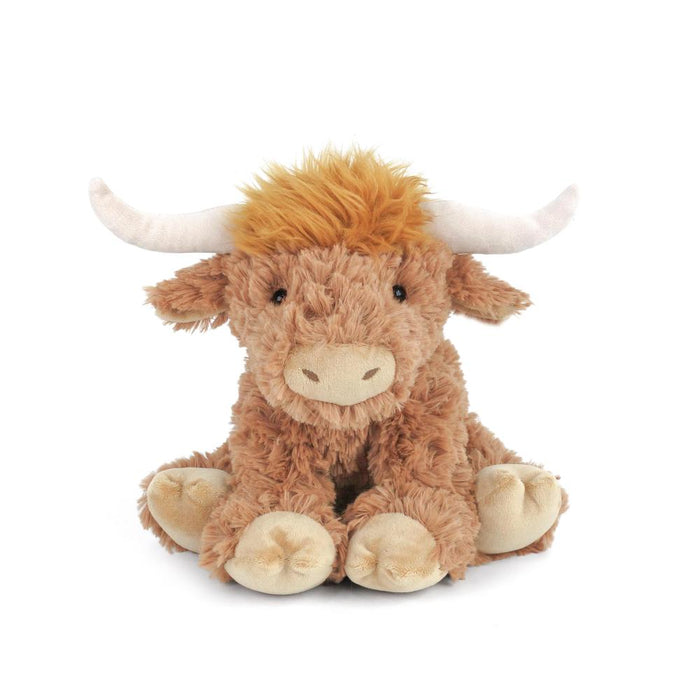 Plush toy highland cow on a white background